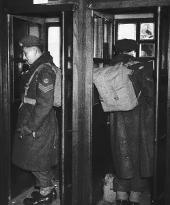 Survivors Prints: WW2 soldiers make phone calls telling their families that they are back in England 1945