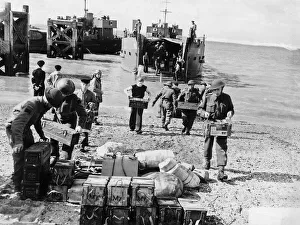 Allies Prints: WW2 - Troops unload supplies from a landing craft on to British soil after a raid