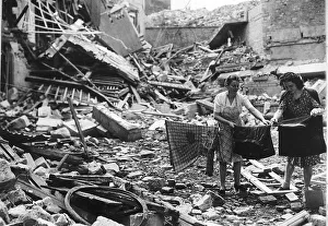 00153 Prints: WW2 Women hanging out washing Jul 44 in Caen France amid bombed ruins