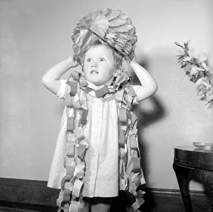 Three year oild Nina Grant seen here playing with christmas decorations December
