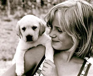 Ten year old Amanda Littlechild holds a puppy in her hands at her home in Kent