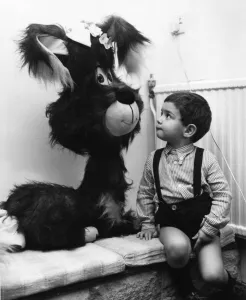 Soft Toy Prints: Two year old Benjamin Ross looks on in wonder at the giant toy dog at Riche of Hay Hill