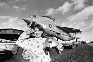 00949 Prints: Eight year old Cheryl James poses beside a T55 Lightning fighter jet