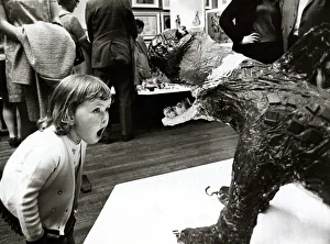 Exhibitions Prints: Three year old Cheryl Thomas looking at a sculptured monster at the National Exhibition