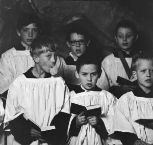 Ten year old choirboy Ian Stacey of Bethnal Green tries to break the concentration of his