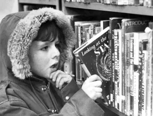 00113 Prints: Five year old Christopher Blanks makes his reading selection at Low Fell library
