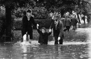 Flooding Prints: Three year old Darren Fitzsimons holds the hands of his mother Eileen