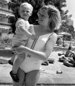00171 Prints: Two year old Gregory Curtis with his mother Jill on holiday in Majorca beside the pool