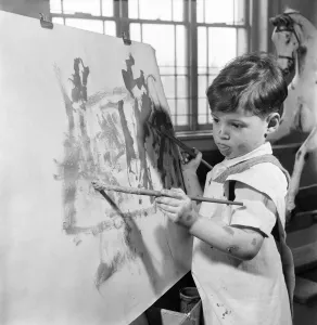 The four year old two handed artist is Louis Savva at work on his masterpiece