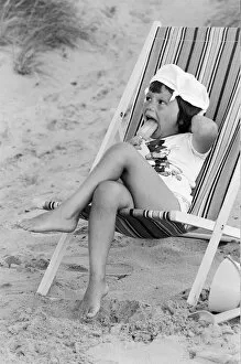 Images Dated 4th August 1977: Four year old Joanna Weaver of Fordcombe, Kent enjoys an ice lolly as she sits in a deck