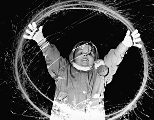 Bonfire Night Prints: Four year old Laura Bowen, of Anfield, having fun with a sparkler. 5th November 1991