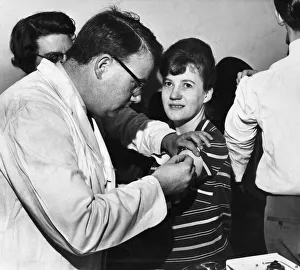 Diseases Prints: Twenty one year old Pamela Garner of Runcorn is vaccinated against smallpox