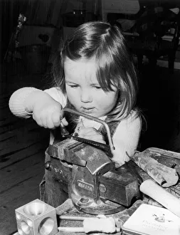 Three year old Pamela Murray working in her dads Silversmiths workshop in Glenrothes