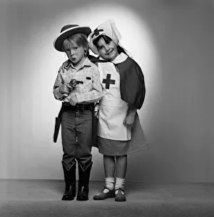Nurse Prints: Four year olds, Angus Wood and Danielle Colls dressed as cowboy and nurse