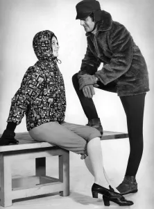 Her yellow stretch knicker-bockers, orange, black and olive anorak with quilted lining