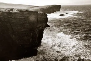 Waves Prints: Yesneby Point - Rough Sea Cliffs Waves crashing into the base of the cliff