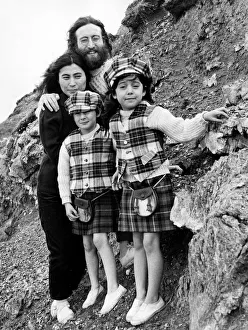 Rocks Prints: Yoko Ono and John Lennon stand on mountain side with Julian Lennon and Kyoko