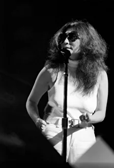 Yoko Ono singing in a charity concert in New York with her husband John Lennon