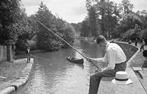 A young angler fishing in the Grand Union Canal between Rickmansworth and Watford