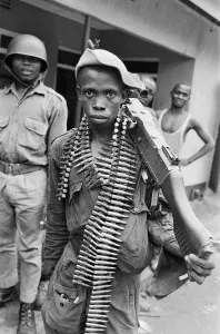 African Prints: A young Biafran soldier seen here posing with a heavy machine gun