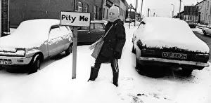 Newspapers Prints: A young boy braves the snow on his paper round in the village of Pity Me in Durham