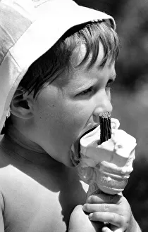 00099 Prints: A young boy enjoys a 99 ice cream at Coventrys War Memorial Park