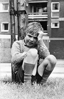 Loneliness Prints: A young boy sits miserable as all his friends aren t outside playing 01 / 06 / 72circa
