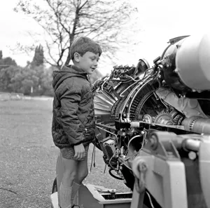 Airforce Prints: A young boy (unidentified) enjoys inspecting an engine at the RAF Display at Caversham