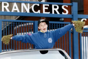 Supporter Prints: Young Colin Wilson can t believe it as he proudly shows off his bits of Ibrox turf