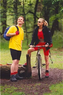 Hiking Prints: A young couple enjoy a romantic day out in the countryside hiking and cycling