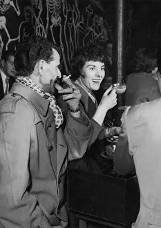 Young couple stop off for a cup of coffee and a cigarette at a coffee bar in London