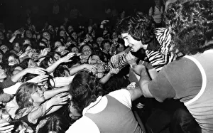 Nightclub Prints: Young fans try to pull DJ Tiger Tim Stevens from the stage in Shuffles Disco during