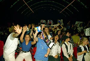 Takethat Prints: Young Take That fans wait for the group to appear on stage at their concert in manchester