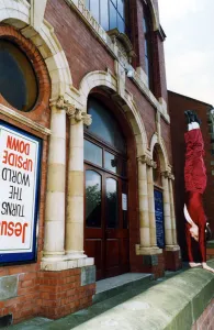 A young girl performing a hand stand outside Guisborough Methodist Church