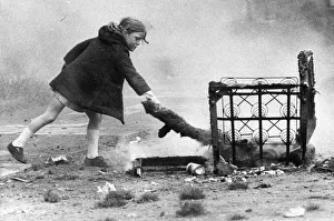 Dangerous Prints: A young girl risks injury playing with fire on wasteland 01 / 11 / 72circa