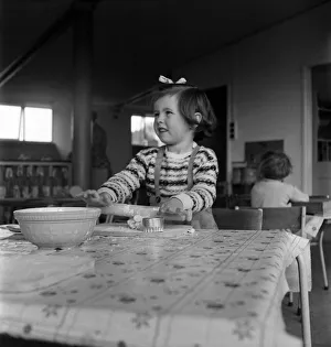 00011 Prints: Young girl rolling out dough in cookery class at Cookham Nursery School