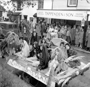 Umbrellas Prints: Young girls from Evington village Kent sat on a trailer through very heavy rain when they