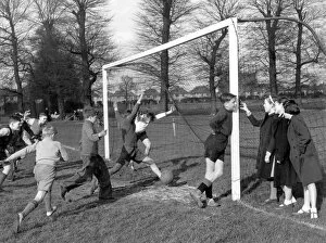 Girl Collection: Young goalkeeper is distracted by a group of girls, as a goal is scored, , 20th April 1951