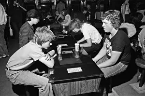 Young holidaymakers play the video machines at the James Corrigan seafront amusement