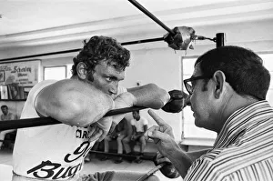A young Joe Bugner (left) with boxing trainer Angelo Dundee in a New York gym