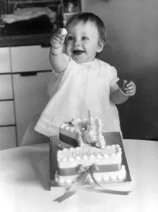 Young Kristen Bullen pictured showing of her cake at her home in Catford