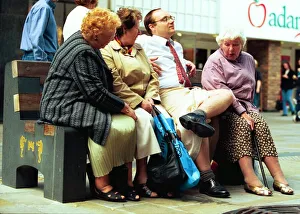 Young man - Reporter Dave Clark wears a Sarong on the streets of Newcastle - much to