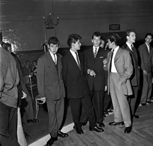 Young men dressed in the latest fashions seen here smoking at the Theatre of Dancing