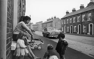Northern Ireland Prints: Young mother seen here with her children in the back streets of Belfast circa 1966