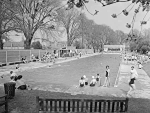 Lido Prints: Young people enjoying the warm spring time sunshine at the Jesus Green, Cambridge