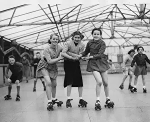 Three young roller skaters on the open air skating rink at Seaburn, l to r, May Harker