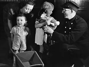 Presents Prints: Young siblings Michael Briggs (aged 2) and older sister Christine (3