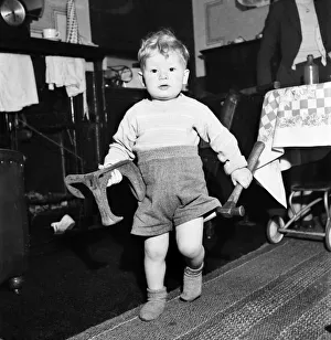 00026 Prints: Young toddler boy holding heavy tools December 1952 C6391