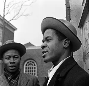 01423 Prints: Young West Indian men standing outside the Brixton Labour Exchange looking for employment
