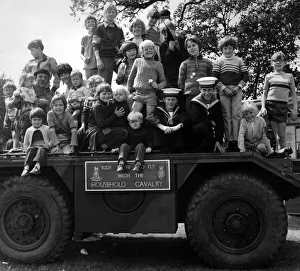 Show Prints: Some of the youngsters at the St Helens show enjoy a look over an armoured scout car